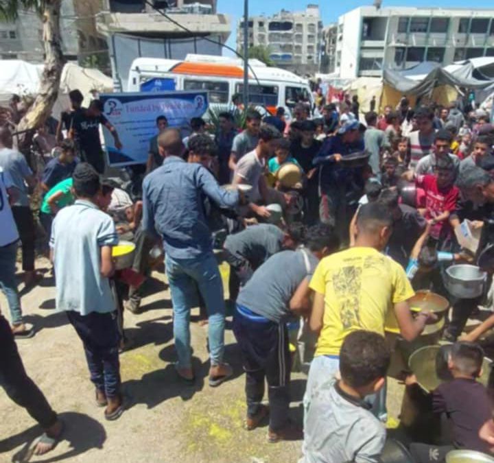 Gaza family on the chaotic food distribution due to starvation
